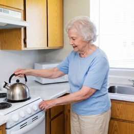 Woman In Kitchen At FSQ Historic Mesa 1000Px