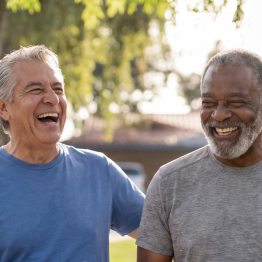 Senior guys outside walking and laughing at Fellowship Square Phoenix Independent Living community