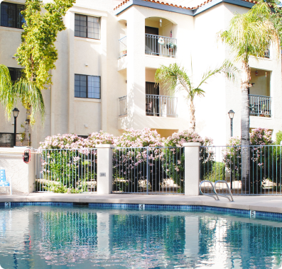 Pool and apt building at Fellowship Square Phoenix Independent Living community