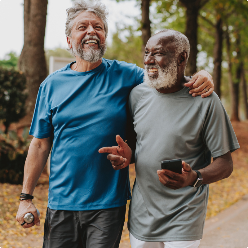 Senior friends enjoying a walk together outdoors at Fellowship Square