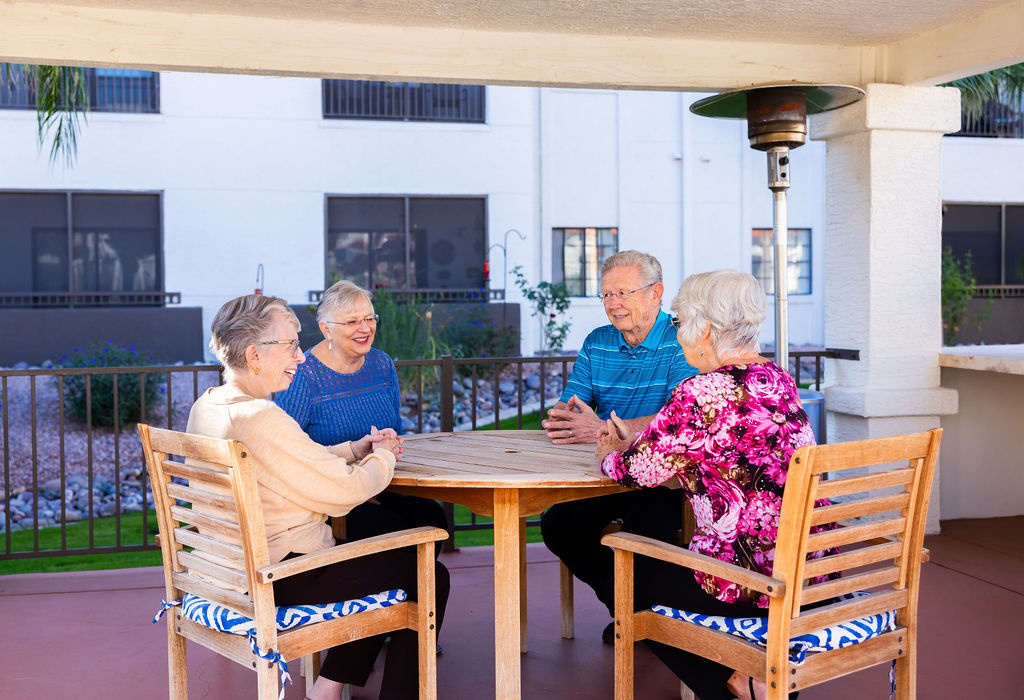 Seniors gathering around a table at Fellowship Square Independent Living Mesa